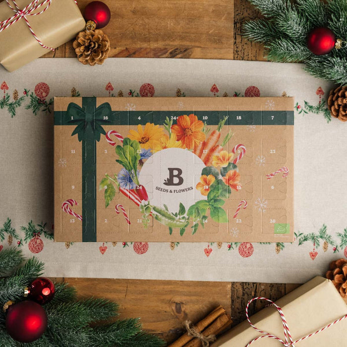 Smuk julekalender med 24 små poser økologiske frø og nedbrydelige fiberpotter, klar til at give glæde til haveentusiaster hele december.