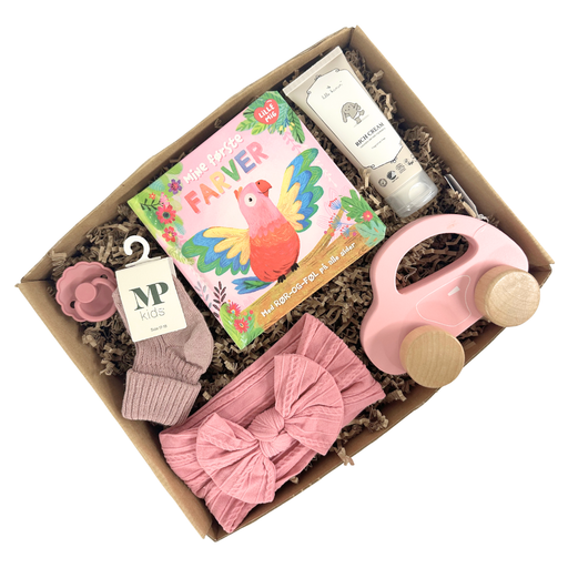 Fin gaveløsning i lyserød med hårbånd, bog om farver og sager til baby