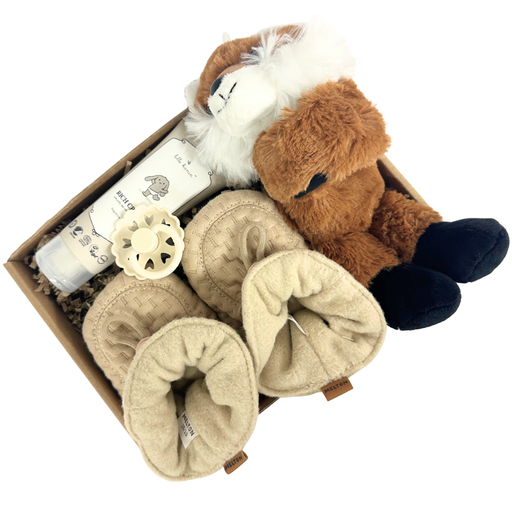 Lille gave med krammeven, futter og sut til baby